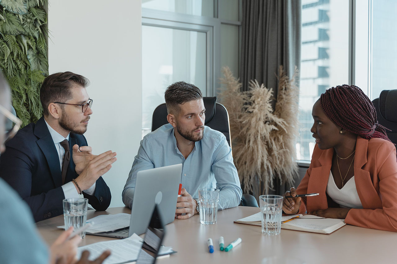 Business professionals discussing a client’s requirements
